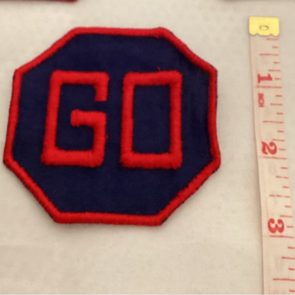 Red and Blue Patch with 'GO' Design